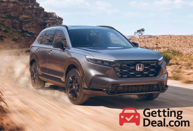2024 Honda CR-V driving on a dusty mountain road, promoting new vehicle advantages with GettingDeal.com branding.